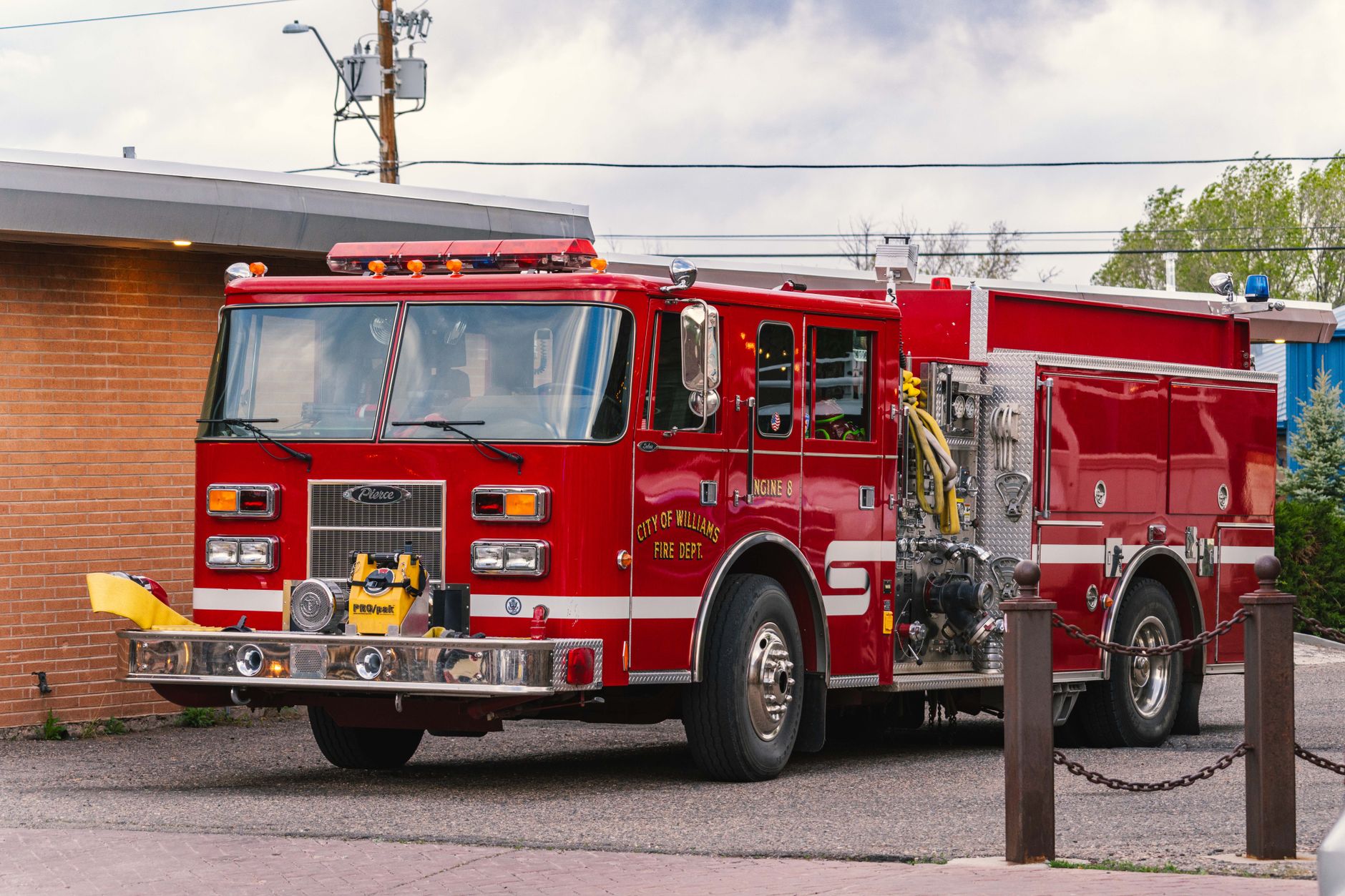 Classic red fire truck from Williams, Arizona Fire Dept parked outdoors.