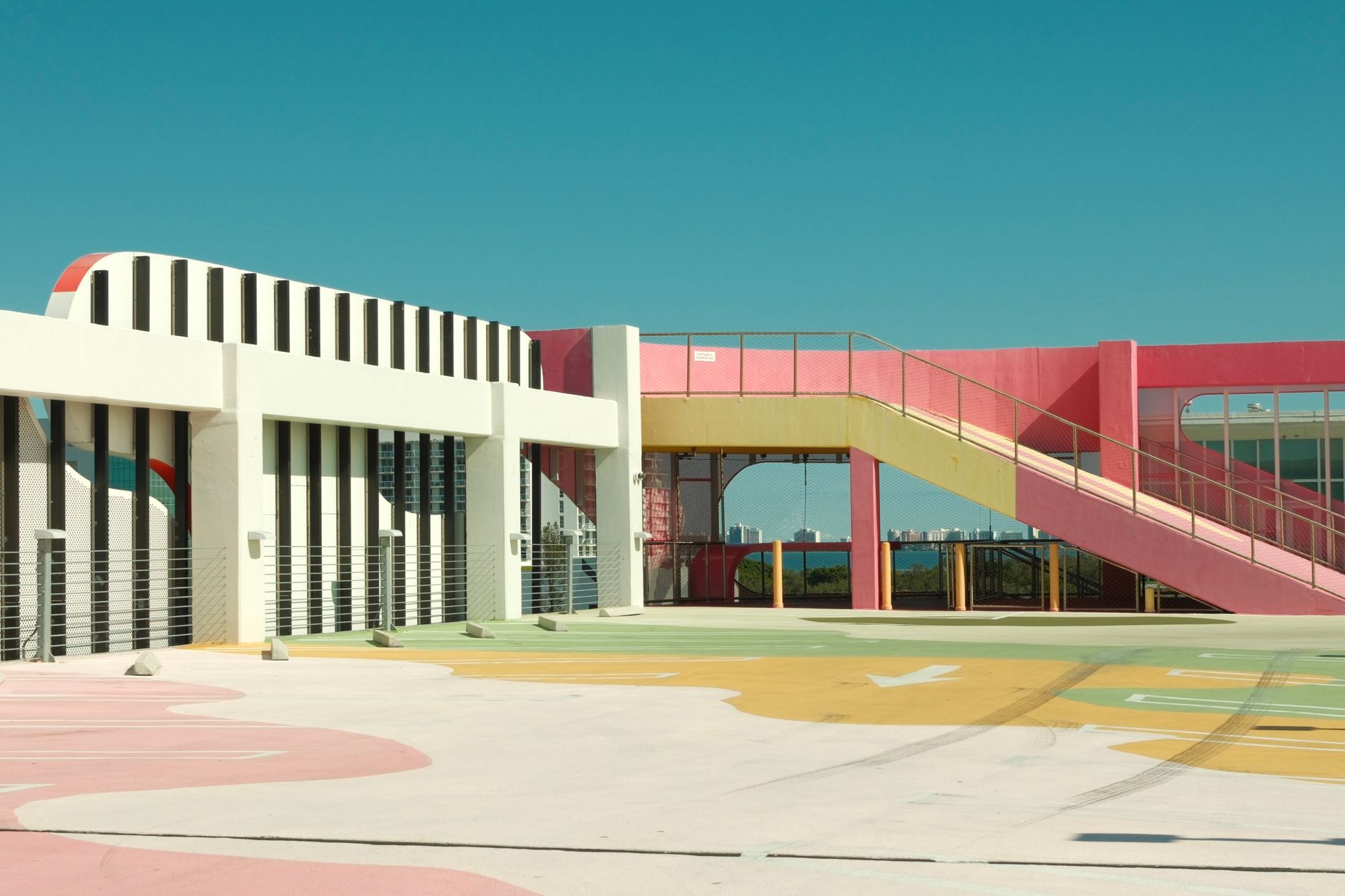 Colorful rooftop with pastel hues and modern architecture under a clear sky in Miami.